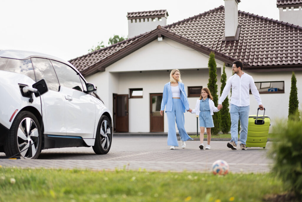 Family Returning Home With Electric Car: Sustainable Living, Happy Moments Together